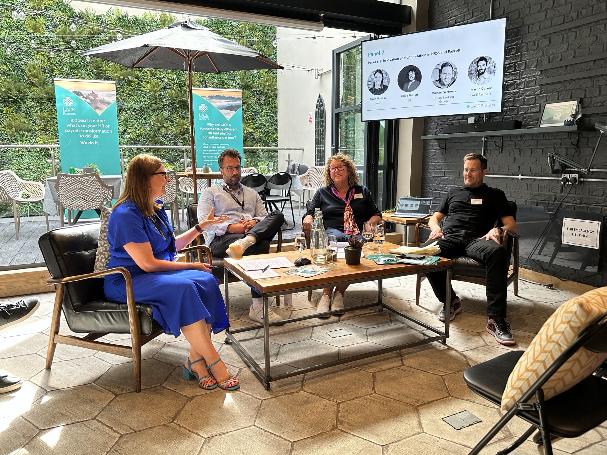 Panel discussion featuring industry leaders: Dawn Goodall, HRSS Lead for LACE Partners, Clare Phillips, Global Head of HR Services and AI HR Champion at IFS and Mike Serbrock, Head of Change and Senior programme manager at Lloyds Banking Group (LBG). 